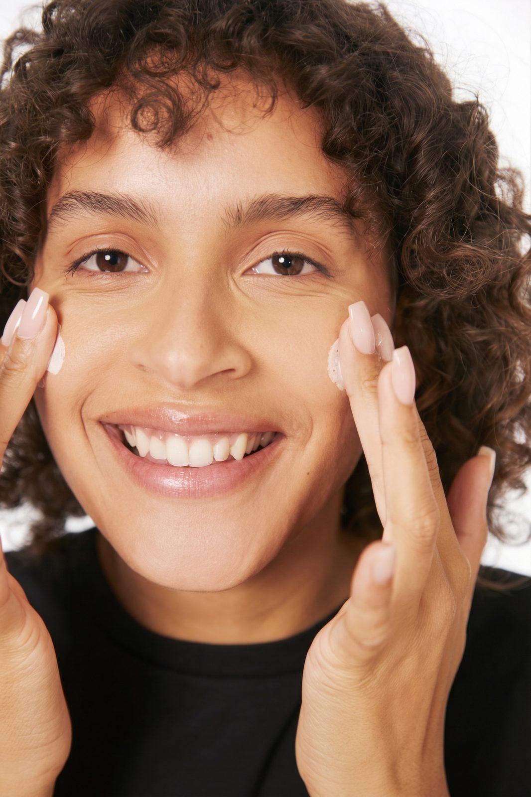 Person applying prescription skincare